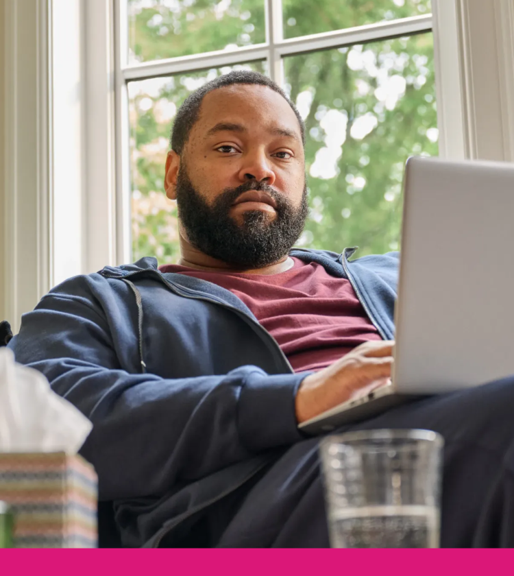 Covid positive man searching for pharmacy on his laptop